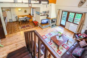 an overhead view of a living room with a couch and a table at Mountain Family Chalet on Prahova Valley in Comarnic