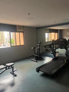 a gym with several tread machines in a room at Flat VMariana PqIbirapuera Borges Lagoa com garagem 1105 in Sao Paulo