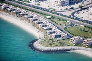 an aerial view of a resort on the beach at Hilton Kuwait Resort in Kuwait