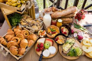 a table topped with lots of different types of food at Radisson Hotel Tamboho Waterfront Antananarivo in Antananarivo
