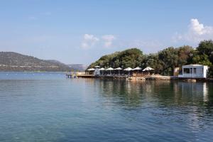 a large body of water with houses on a dock at Susona Bodrum, LXR Hotels & Resorts in Bodrum City