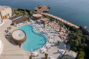 an aerial view of a resort with a swimming pool at Susona Bodrum, LXR Hotels & Resorts in Bodrum City