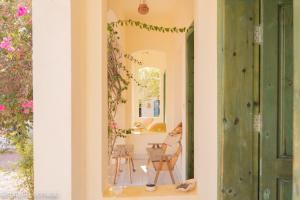 a room with a mirror and a table and chairs at Marine Garden Camp in Dahab