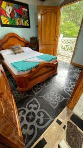 Postel nebo postele na pokoji v ubytování Hostal Vista Hermosa