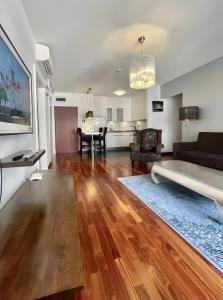 a living room with a couch and a table at NOVO Central Apartments in Budapest