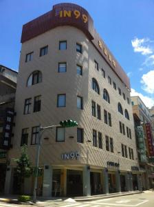 a large building with a sign on top of it at IN99 Hotel in Jincheng