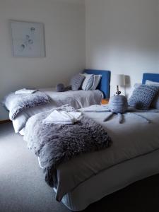 Ένα ή περισσότερα κρεβάτια σε δωμάτιο στο The Lakes Apartments +20 φωτογραφίες