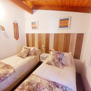 Un pat sau paturi într-o cameră la Amutuy Bariloche