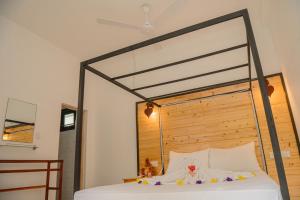 Letto o letti in una camera di Rekawa Turtle Gate Hotel