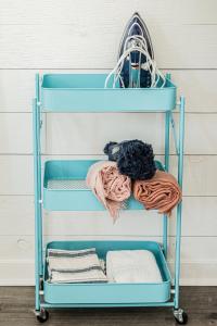 a blue ironing rack with towels on it at Vanderbilt Beach Studio in Naples