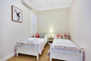 a bedroom with two beds and a window at Sydney CBD Waterview apartment56 in Sydney
