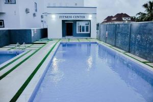 a swimming pool in front of a building at Luxury 4bed Harris Drive Lekki in Lagos