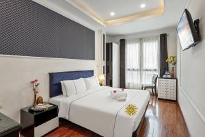 Golden Sun Hotelにあるベッド