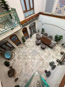 an overhead view of a patio with a table and chairs at Boutique Safiya in Bukhara