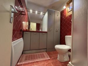 a small bathroom with a toilet and a sink at Appartement pour 9 pers à Montgenèvre, WIFI, parking privé - FR-1-330D-133 in Montgenèvre +18 photos