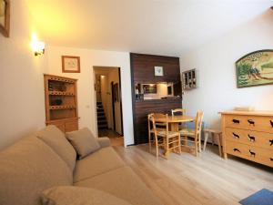 a living room with a couch and a table at Studio Avoriaz, 1 pièce, 4 personnes - FR-1-314-170 in Morzine