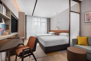 Postel nebo postele na pokoji v ubytování Home2 Suites by Hilton Guiyang Guanshanhu
