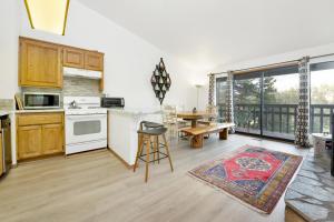 a kitchen and dining room with a table at 2341-Bear Meadow Woods Condo condo in Big Bear Lake
