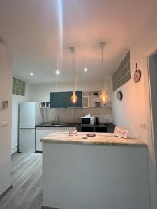 a kitchen with a counter top and a refrigerator at Cinque terre Portovenere in La Spezia