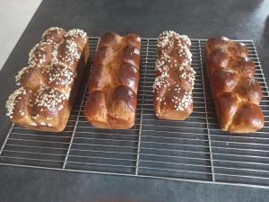four different types of pastries on a cooling rack at Philippe et Éliane in Matha