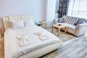 En eller flere senge i et værelse på Studio Bel Air Paradise