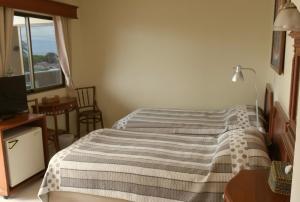 Postel nebo postele na pokoji v ubytování Fulay Hotel