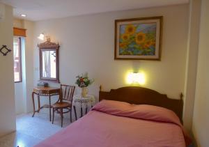 Postel nebo postele na pokoji v ubytování Fulay Hotel