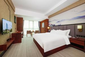 เตียงในห้องที่ Xiamen Xiangzun Hotel - Huijing Plaza Branch