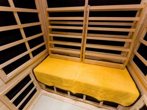 a small room with a yellow bench in a room at Rakuten STAY VILLA Fuji Kawaguchiko Forest 2LDK with sauna and terrace-Pet Friendly- in Fujikawaguchiko