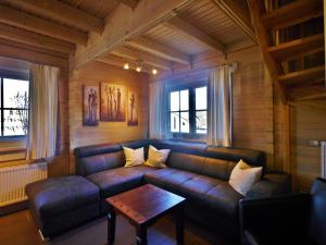 a living room with a couch and a table at FerienBlockhaus Willingen mit MeineCardPlus in Willingen