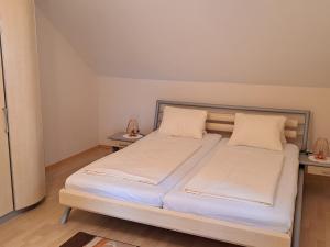 Łóżko lub łóżka w pokoju w obiekcie Appartement Schober