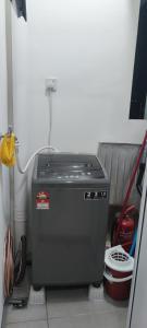a water heater sitting in a room with at Meritus Service Apartment in Perai