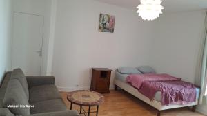Postel nebo postele na pokoji v ubytování Appartement 9ème