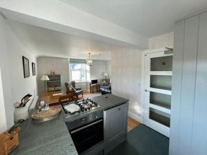 A kitchen or kitchenette at Perfectly Located, Central Bowness Flat With Free Parking and Lake Views
