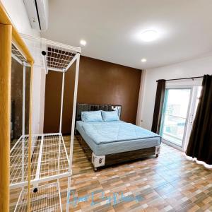 a bedroom with a bunk bed and a ladder at GoodDay Poolvilla UdonThani บ้านพูลวิลล่ากู๊ดเดย์ อุดรธานี in Udon Thani