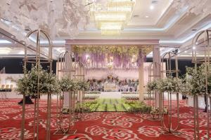 an image of a banquet hall with a chandelier at The Rich Jogja Hotel in Yogyakarta +34 photos