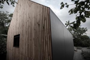 a wooden building with a window on the side of it at Moon - Tiny house from Callin Wines in Sežana +11 photos