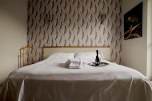 Postel nebo postele na pokoji v ubytování Hotel Frejus