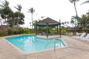 a swimming pool with a gazebo in a resort at Ilima West Kuilima Estates 18 At Turtle Bay in Kahuku