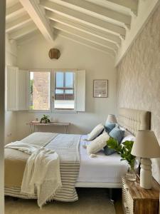 a bedroom with a large bed and a window at Casa Nueva cerca del Mar en cala Berellin in Prellezo