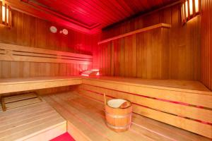an empty sauna with a barrel in the middle at PLAZA Premium Wien in Vienna