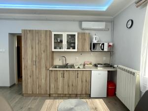 Kuchyň nebo kuchyňský kout v ubytování Belien Apartman