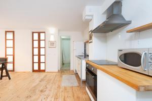 A kitchen or kitchenette at Stylish Apartments w Balcony in the Very Center by Sea N' Rent