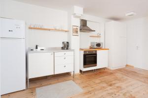 A kitchen or kitchenette at Stylish Apartments w Balcony in the Very Center by Sea N' Rent