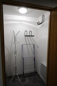 a bathroom with a towel rack and a bath tub at Maison Eugénie in Luchon