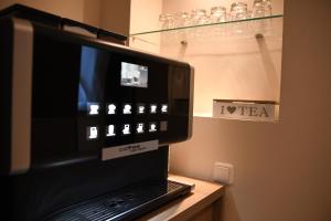 Sjónvarps- og/eða afþreyingartæki á Ata Hotel - Self Check-in