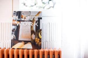 a fire and work magazine on a radiator in a room at TREMONDI - Boutique BnB in Quarten