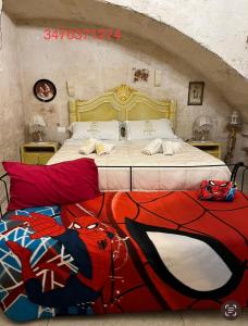 Postel nebo postele na pokoji v ubytování Palazzo Savoia 1856