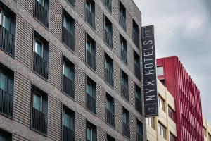 a building with a sign on the side of it at NYX Hotel Hamburg by Leonardo Hotels in Hamburg
