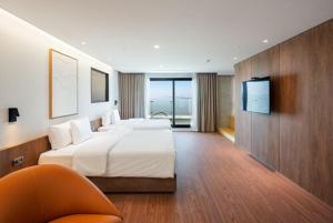 Hotel Cielo客房内的一张或多张床位
